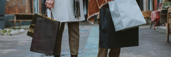 two women with shopping bags