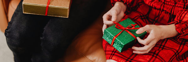 child unwrapping gift